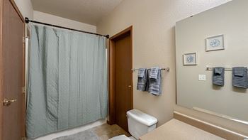 the private bathroom includes a shower and a toilet